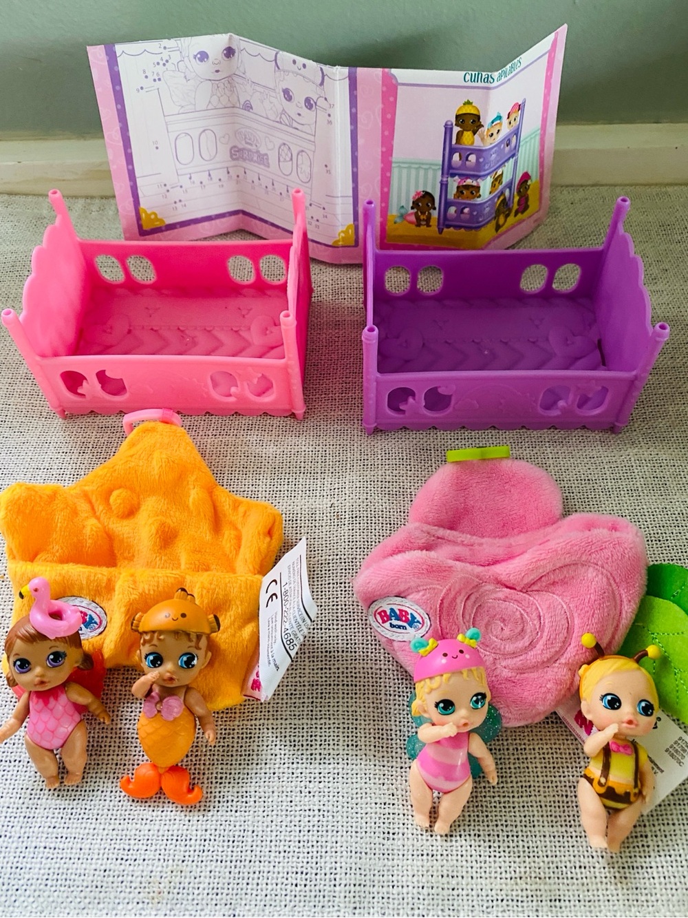 Baby Born Surprise 4 Mini Babies Mini Dolls Playset w Pink & Purple Cribs